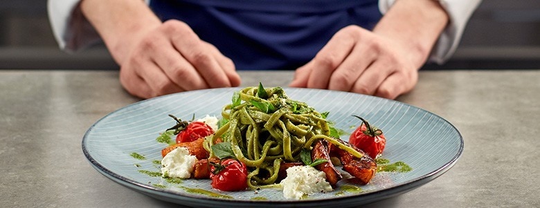 Green pasta with fresh tomatoes and cheese Green pasta with fresh tomatoes and cheese