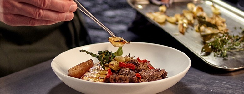 Beautifully plated meat dish with different textures Beautifully plated meat dish with different textures